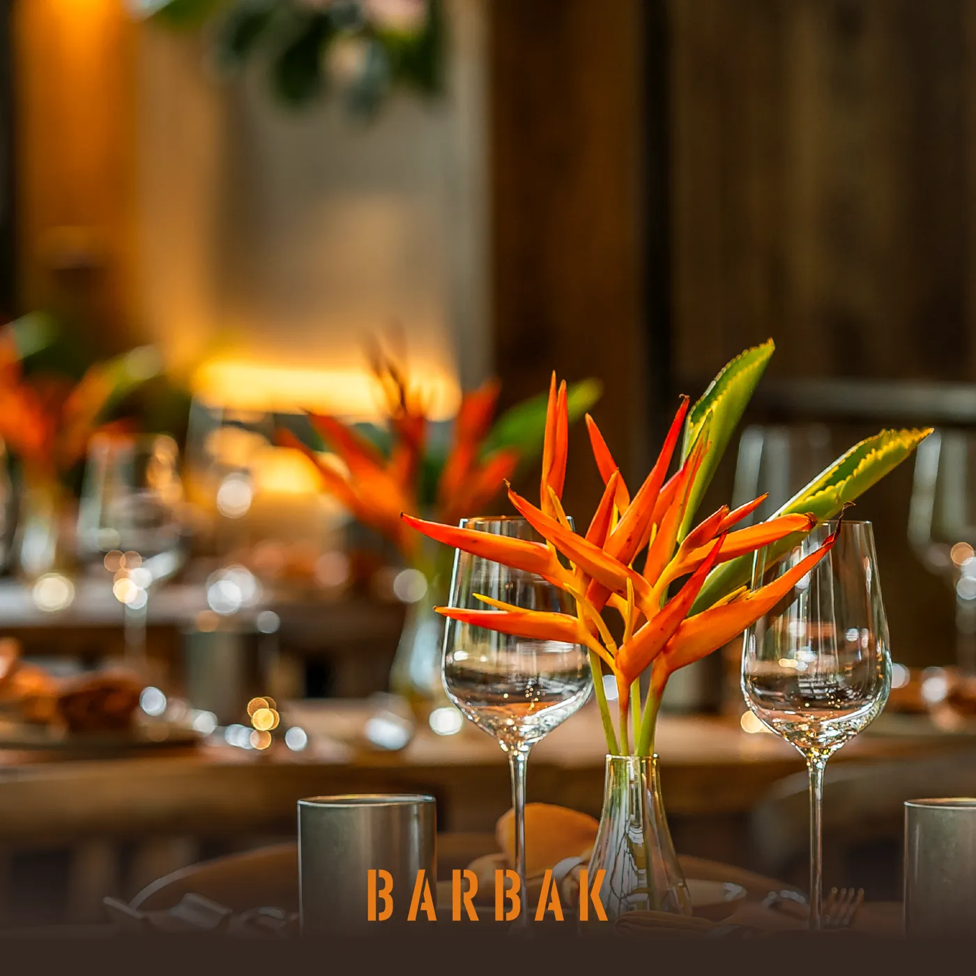 A heliconia centrepiece on a set table