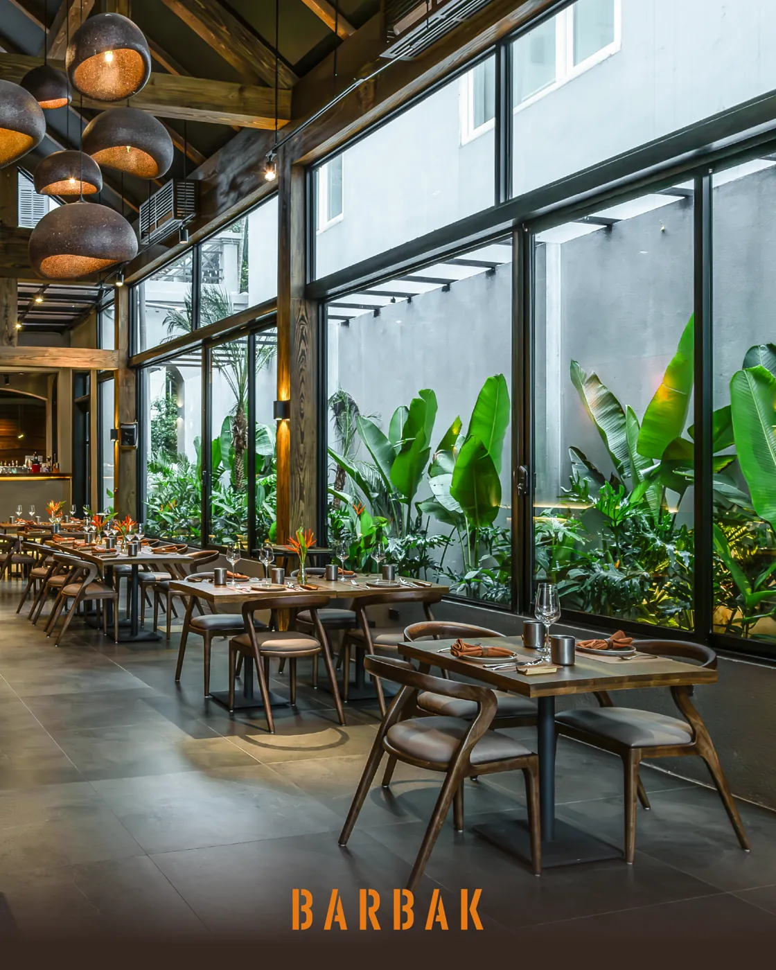The sunlit garden-glass dining room